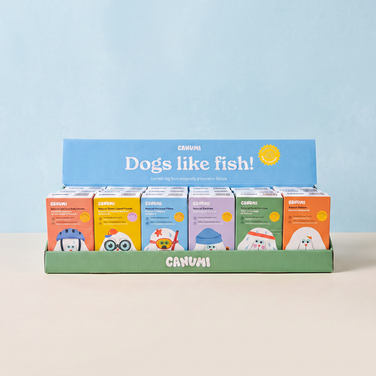 Canumi six-flavour discovery bundle for dogs, with all six seafood toppers in the branded display box